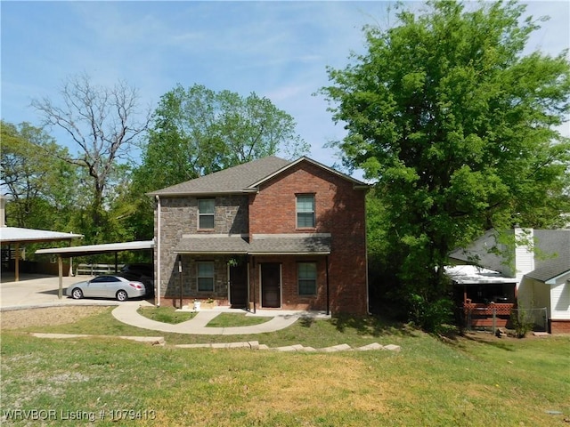 view of front of property featuring brick siding, a front yard, roof with shingles, a carport, and stone siding