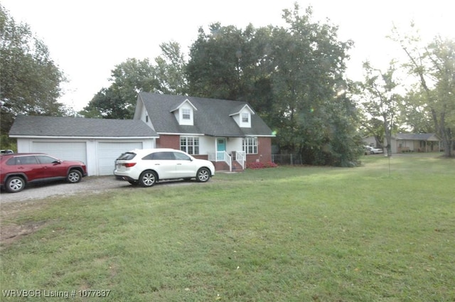 view of front facade with a garage and a front lawn