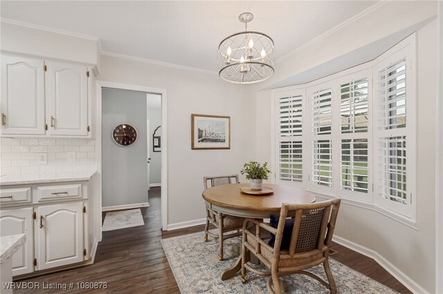 6410 Ellsworth Rd, Fort Smith, AR 72903 - dining space featuring a chandelier, dark wood-style floors, crown molding, and baseboards