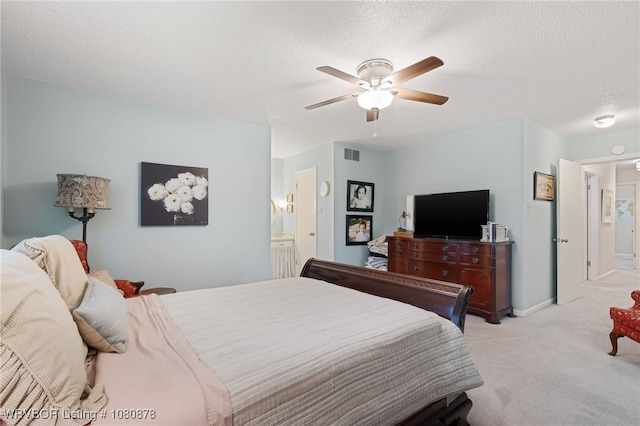6410 Ellsworth Rd, Fort Smith, AR 72903 - bedroom featuring light carpet, a ceiling fan, a textured ceiling, ensuite bath, and baseboards