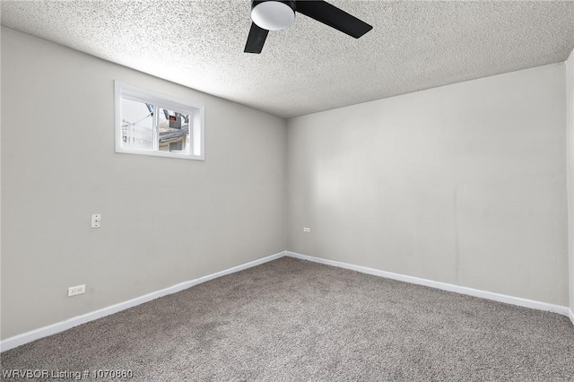 spare room with carpet, a textured ceiling, and ceiling fan