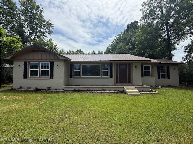 1505 E Main St, Lavaca, AR 72941 - single story home with a front yard, a metal roof, and covered porch