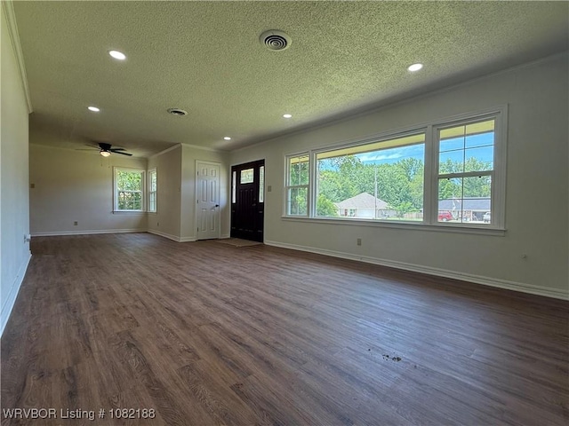 1505 E Main St, Lavaca, AR 72941 - unfurnished living room featuring a textured ceiling, recessed lighting, dark wood-style flooring, ceiling fan, and ornamental molding