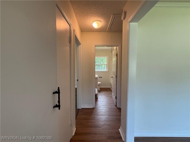 1505 E Main St, Lavaca, AR 72941 - hall featuring attic access, dark wood-type flooring, and a textured ceiling