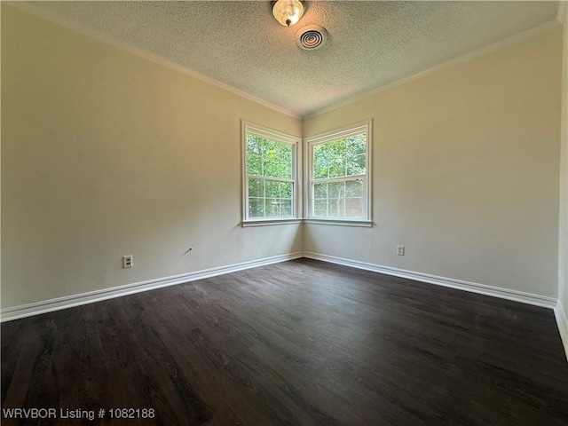 1505 E Main St, Lavaca, AR 72941 - spare room featuring dark wood-style flooring, a textured ceiling, and ornamental molding