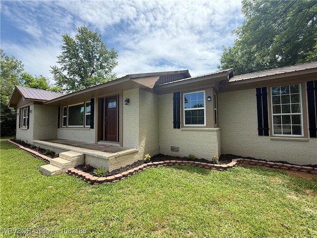 1505 E Main St, Lavaca, AR 72941 - ranch-style home featuring a metal roof, a front lawn, and brick siding