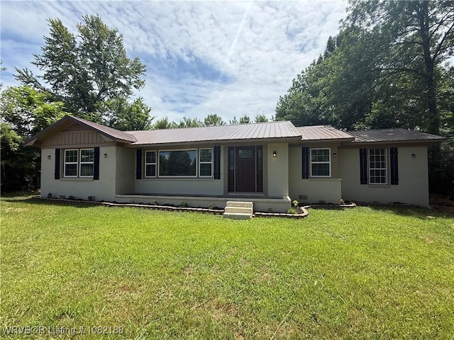 1505 E Main St, Lavaca, AR 72941 - ranch-style house featuring a metal roof and a front lawn