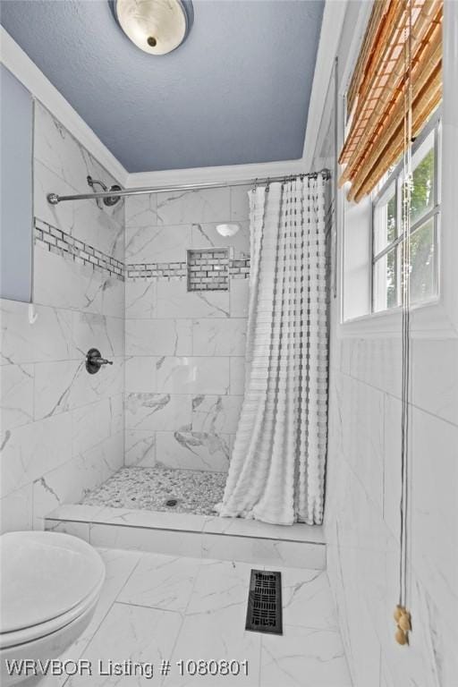 3815 Free Ferry Ln, Fort Smith, AR 72903 - bathroom with marble look tiles, tiled shower, and toilet