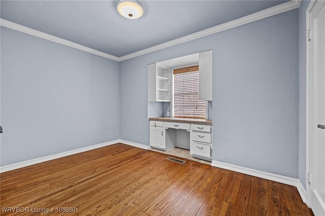 3815 Free Ferry Ln, Fort Smith, AR 72903 - unfurnished office featuring built in study area, light wood-style floors, baseboards, and crown molding