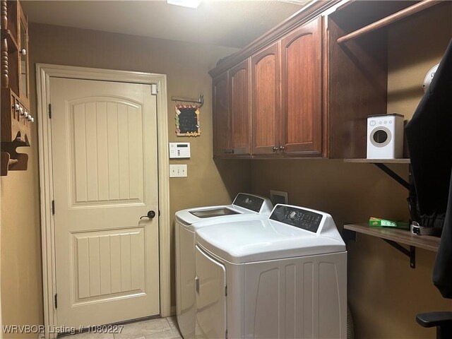 304 Caseys Ct, Lavaca, AR 72941 - clothes washing area featuring cabinet space and washer and clothes dryer