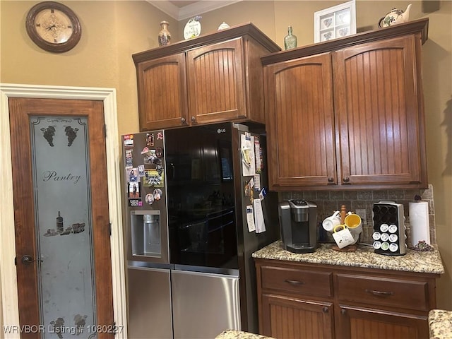 304 Caseys Ct, Lavaca, AR 72941 - kitchen featuring ornamental molding, backsplash, stainless steel fridge, and light stone countertops