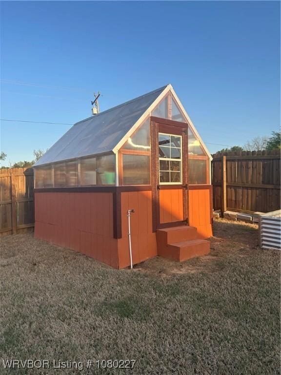 304 Caseys Ct, Lavaca, AR 72941 - view of greenhouse with a fenced backyard and a lawn