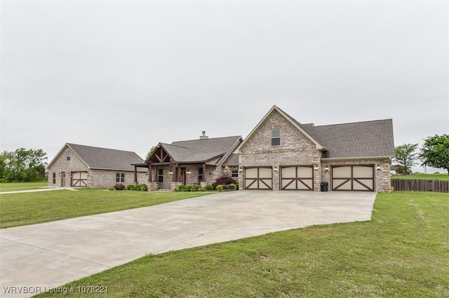 view of front of property with a front yard and a garage