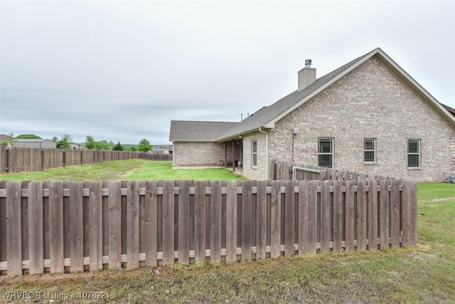 view of home's exterior with a yard