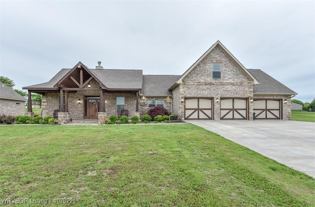 view of front of home with a garage and a front yard