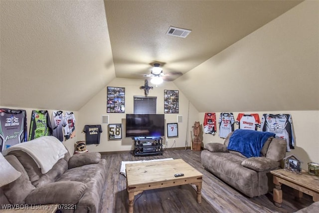 living room featuring hardwood / wood-style floors, a textured ceiling, vaulted ceiling, and ceiling fan