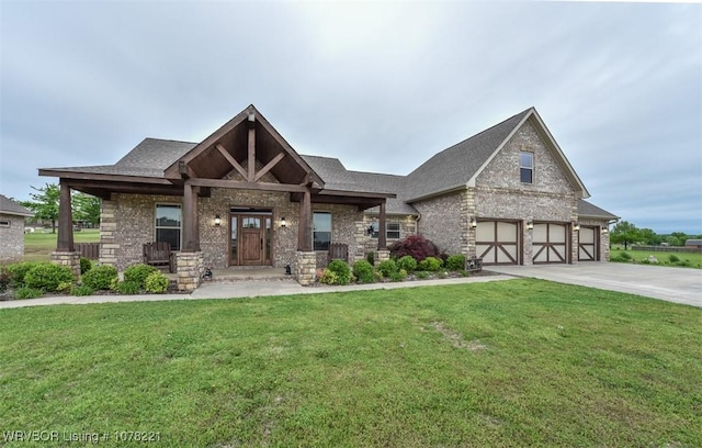 view of front of house featuring a front lawn and a garage