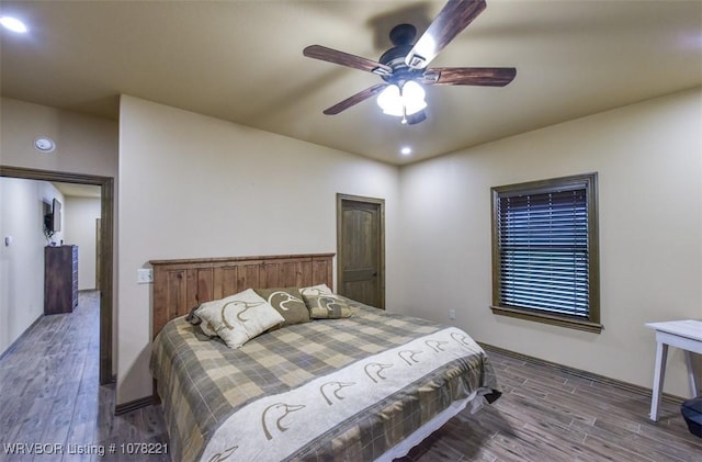 bedroom featuring hardwood / wood-style floors and ceiling fan