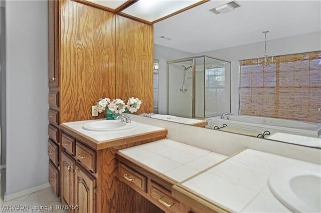 bathroom featuring vanity, tile patterned floors, and shower with separate bathtub