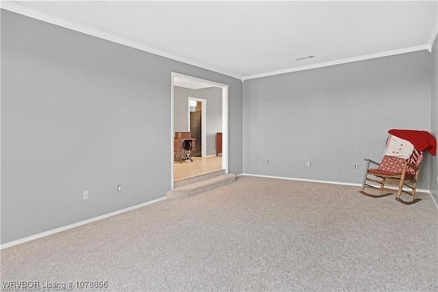 unfurnished room featuring crown molding and light colored carpet