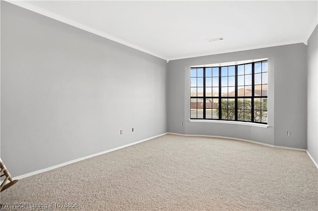 carpeted spare room with ornamental molding