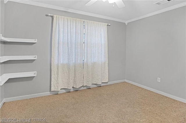 carpeted empty room with ceiling fan and ornamental molding