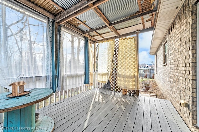 wooden terrace featuring fence