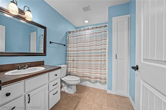 bathroom with vanity, visible vents, shower / tub combo, tile patterned floors, and toilet