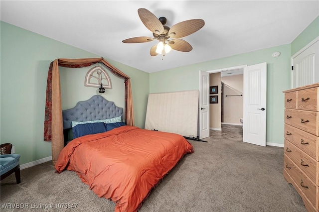 carpeted bedroom with ceiling fan and baseboards