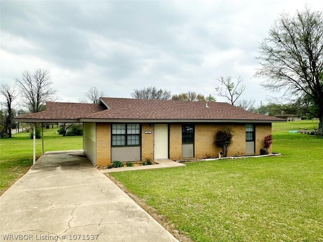 ranch-style house featuring a front yard and a carport