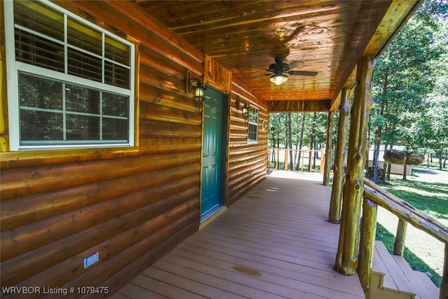 wooden terrace featuring a porch and ceiling fan