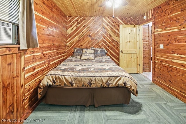 bedroom featuring wooden walls, wood ceiling, carpet floors, cooling unit, and a ceiling fan