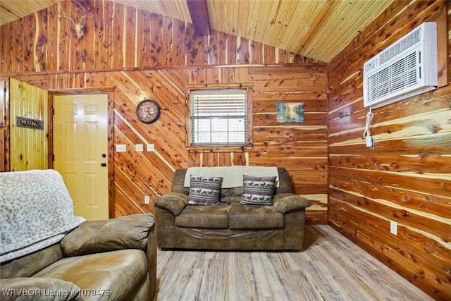 living area with a wall mounted AC, lofted ceiling with beams, wood finished floors, wooden walls, and wooden ceiling