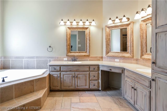 full bathroom with a garden tub, double vanity, a sink, and stone tile floors