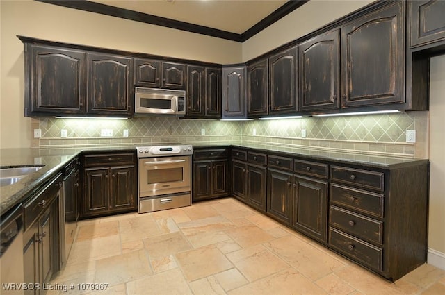 kitchen with ornamental molding, stainless steel appliances, backsplash, and dark stone counters