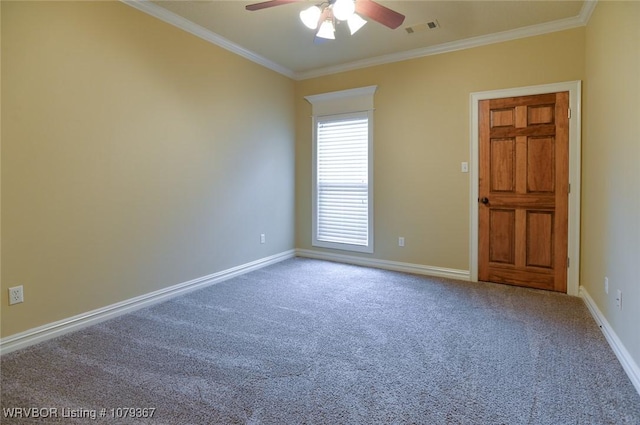 unfurnished room featuring carpet floors, ornamental molding, visible vents, and baseboards