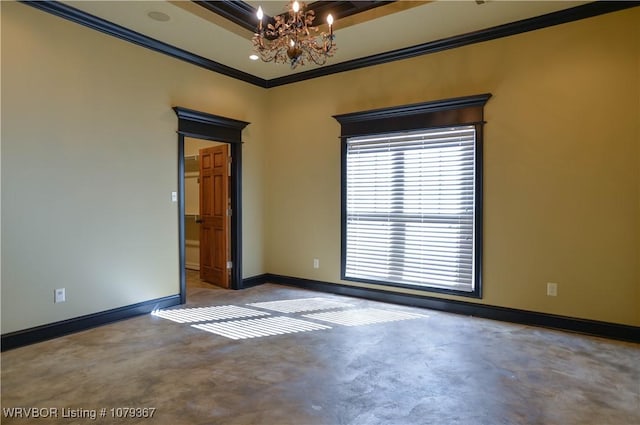 spare room featuring a tray ceiling, a notable chandelier, crown molding, concrete floors, and baseboards