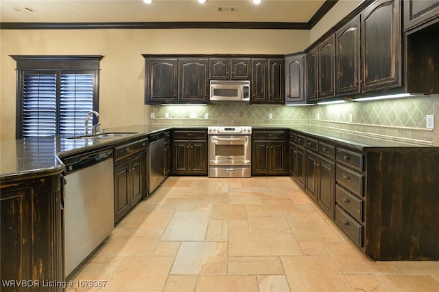 kitchen with stone tile flooring, visible vents, appliances with stainless steel finishes, ornamental molding, and a sink