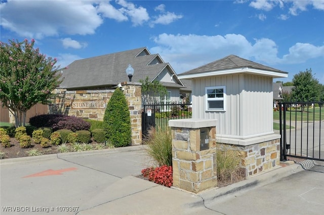 exterior space with board and batten siding and fence