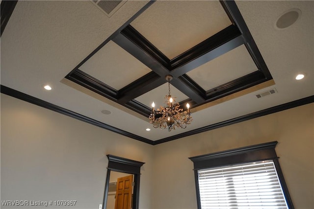 details featuring visible vents, coffered ceiling, ornamental molding, a chandelier, and beam ceiling