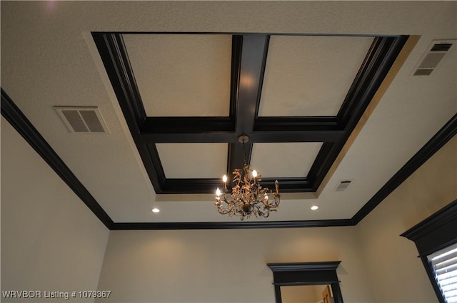 room details with visible vents, coffered ceiling, and crown molding