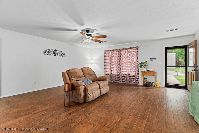 451 Hill St, Booneville, AR 72927 - sitting room with a textured ceiling, visible vents, ceiling fan, and wood finished floors