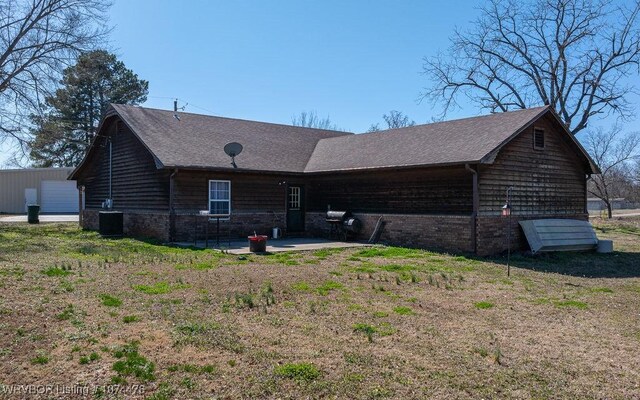 exterior space with central AC unit and a patio area