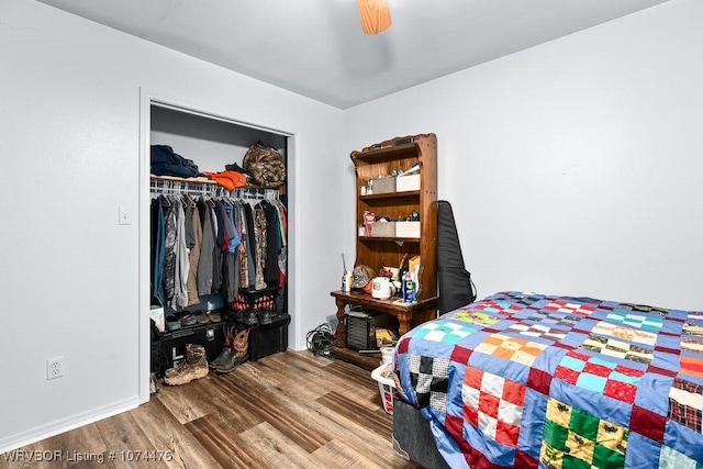 bedroom with wood-type flooring, a closet, and ceiling fan