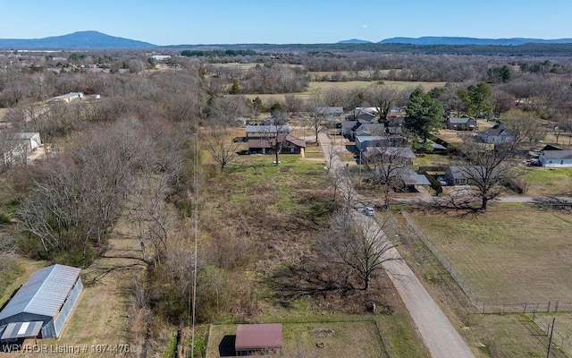 birds eye view of property with a mountain view