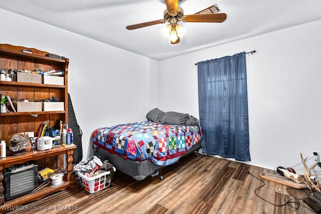 bedroom featuring ceiling fan and hardwood / wood-style flooring