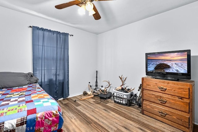 bedroom with hardwood / wood-style flooring and ceiling fan