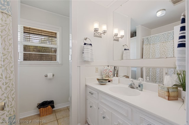 3032 King Dr, Mulberry, AR 72947 - bathroom featuring crown molding, vanity, tile patterned flooring, visible vents, and baseboards