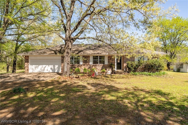 3032 King Dr, Mulberry, AR 72947 - ranch-style house with a front yard, brick siding, an attached garage, and dirt driveway