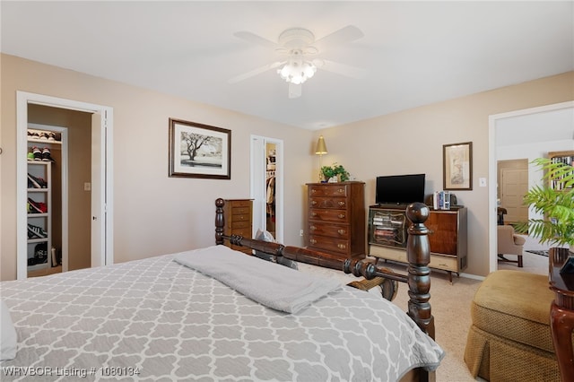 3032 King Dr, Mulberry, AR 72947 - carpeted bedroom with a closet, a walk in closet, and a ceiling fan